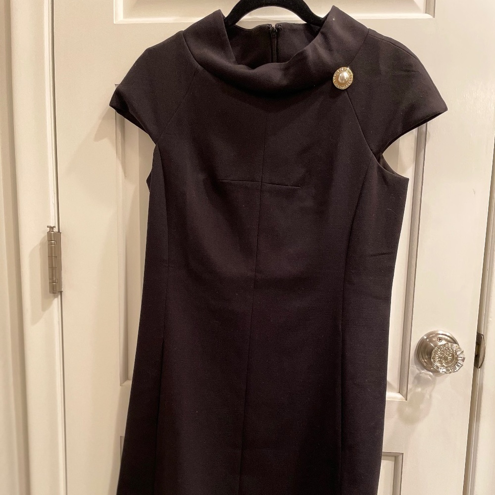 black a line dress with pearl detail